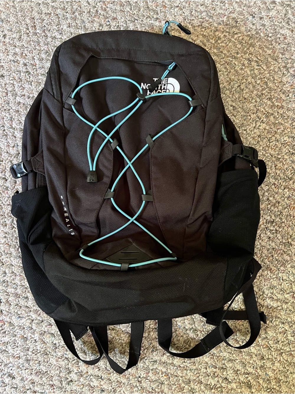 The North Face Black Backpack with Teal Accent Bungee